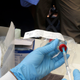 A health worker prepares an Ebola vaccine to administer to health workers during a vaccination campaign in Mbandaka, Congo.